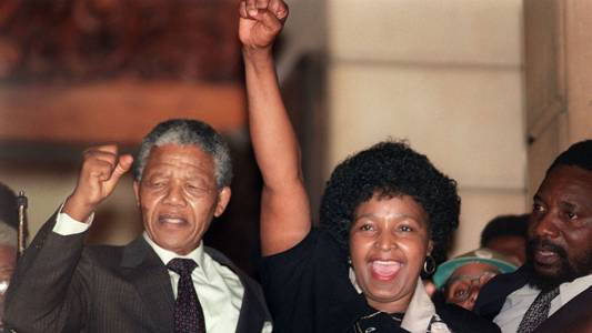 In this file photo taken on Feb. 11, 1990, anti-apartheid leader and African National Congress member Nelson Mandela and his wife, Winnie, raise their fists in Paarl, South Africa, to salute a cheering crowd upon Mandela's release from Victor Verster prison